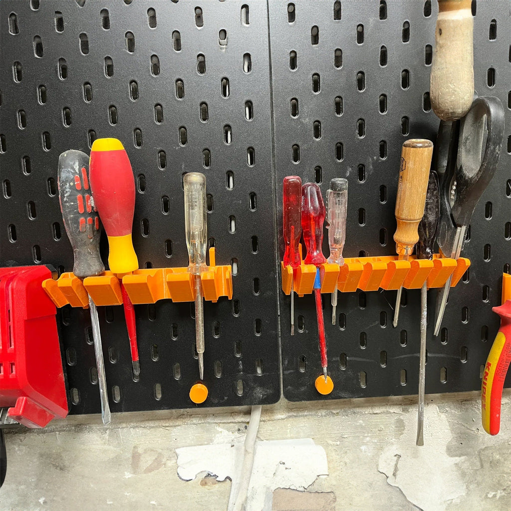 Screwdriver holder for IKEA SKADIS pegboard with angled slots holding drivers handle up, view 3