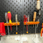 Screwdriver holder for IKEA SKADIS pegboard with angled slots holding drivers handle up, view 3
