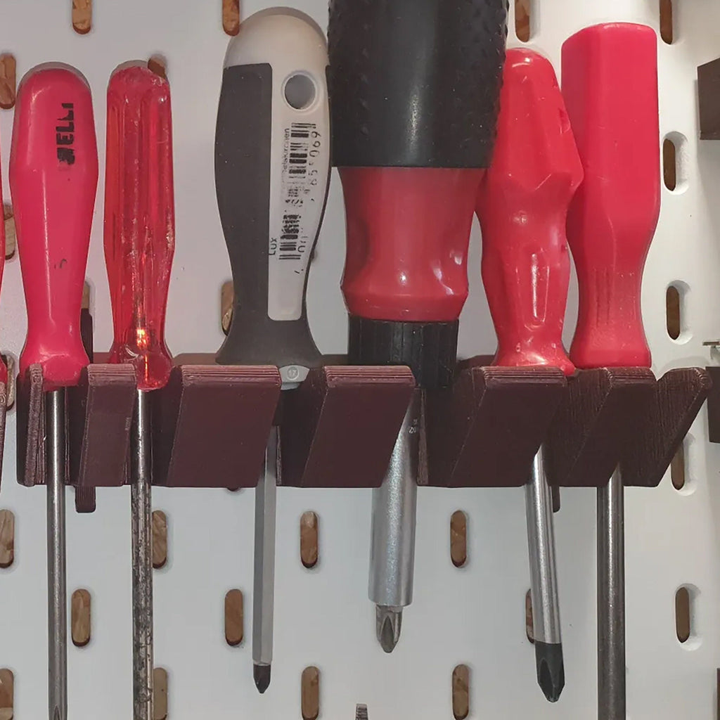 Screwdriver holder for IKEA SKADIS pegboard with angled slots holding drivers handle up, view 4