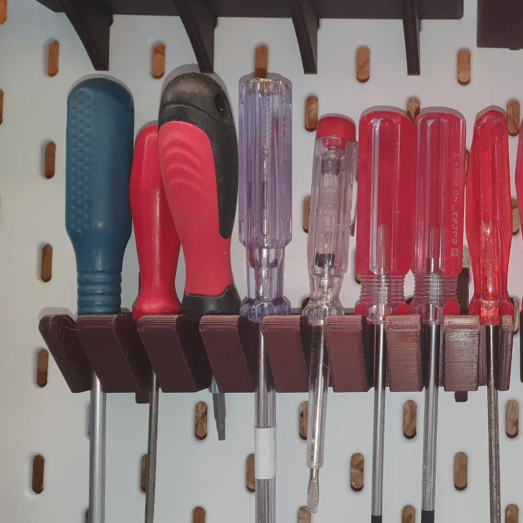 Screwdriver holder for IKEA SKADIS pegboard with angled slots holding drivers handle up, view 5