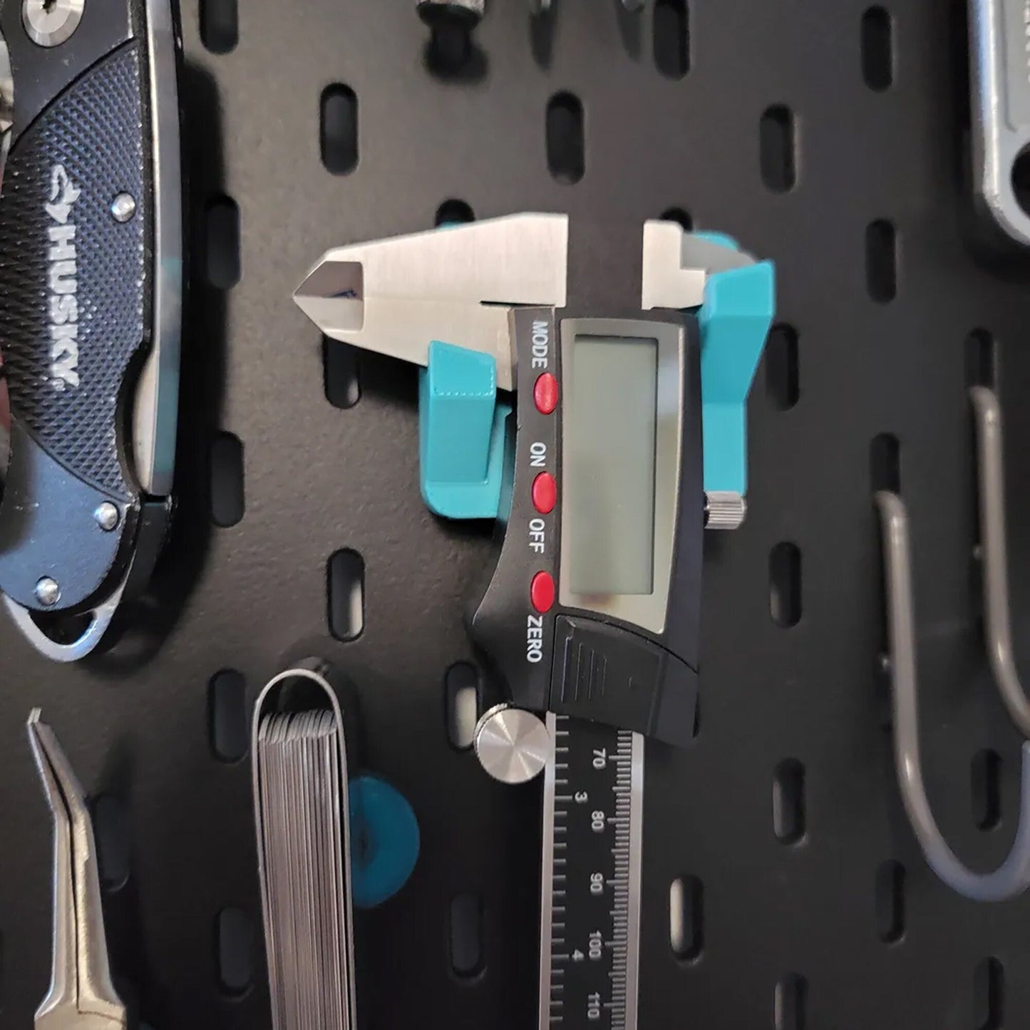 a close up of a caliper on a wall