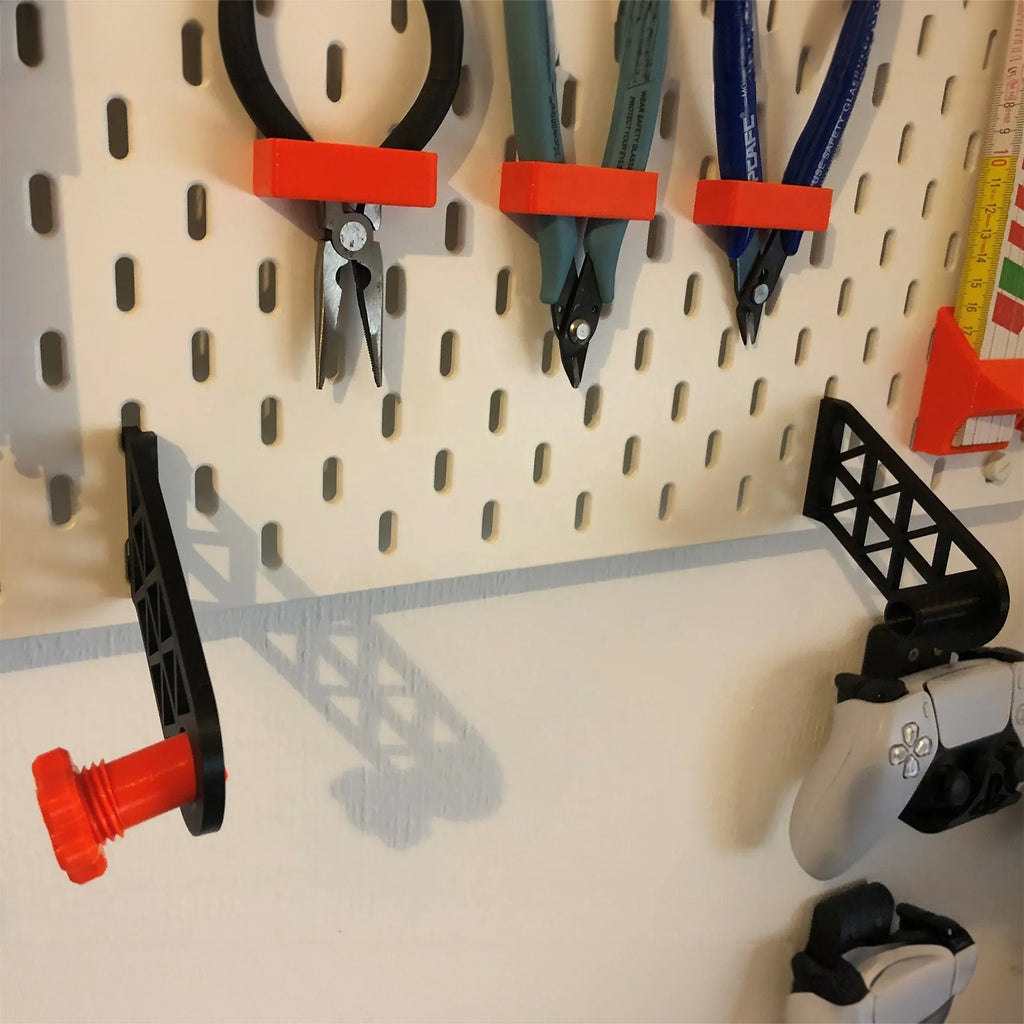Paper towel holder for IKEA SKADIS pegboard with a kitchen roll on a rotating end cap, view 3