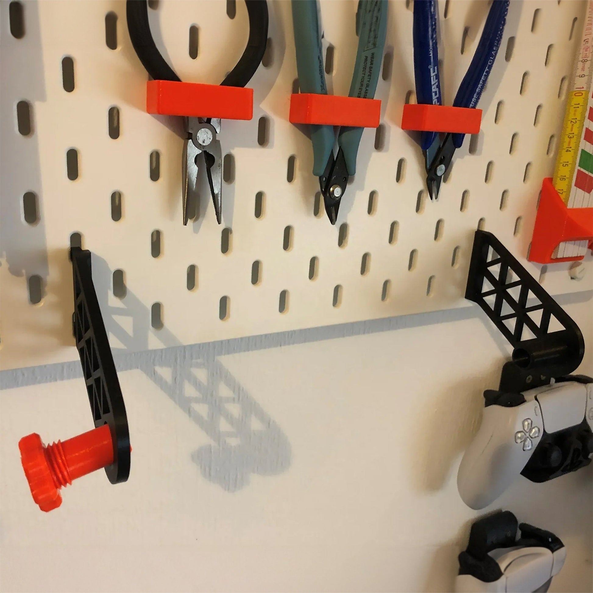 a peg board with scissors and other tools on it