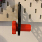 Paper towel holder for IKEA SKADIS pegboard with a kitchen roll on a rotating end cap, view 4