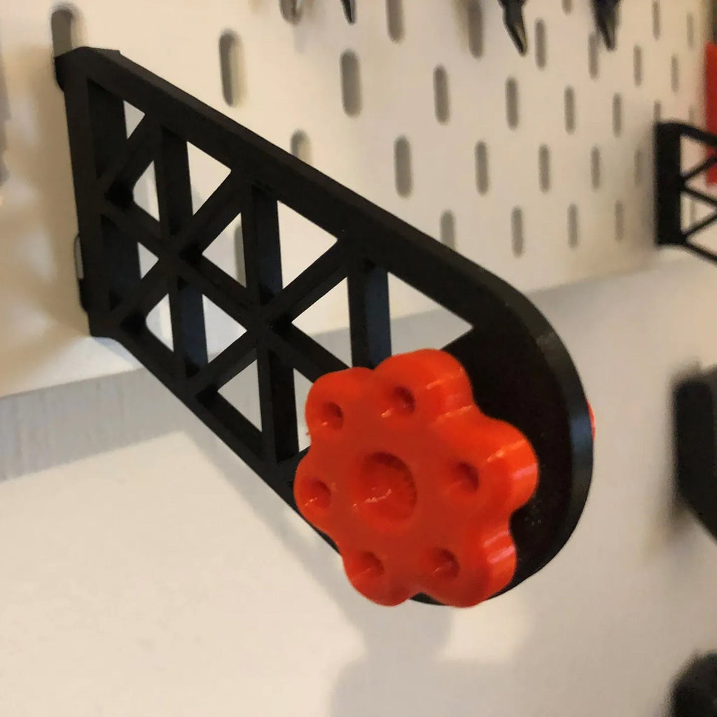 Paper towel holder for IKEA SKADIS pegboard with a kitchen roll on a rotating end cap, view 6