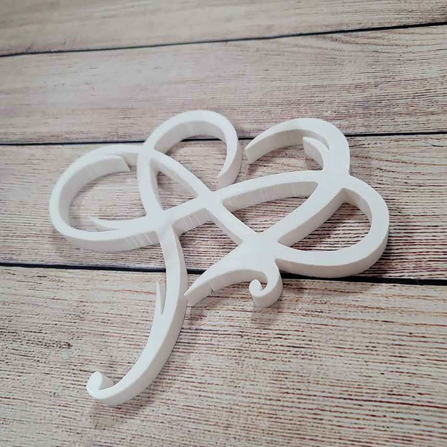 a pair of scissors sitting on top of a wooden table