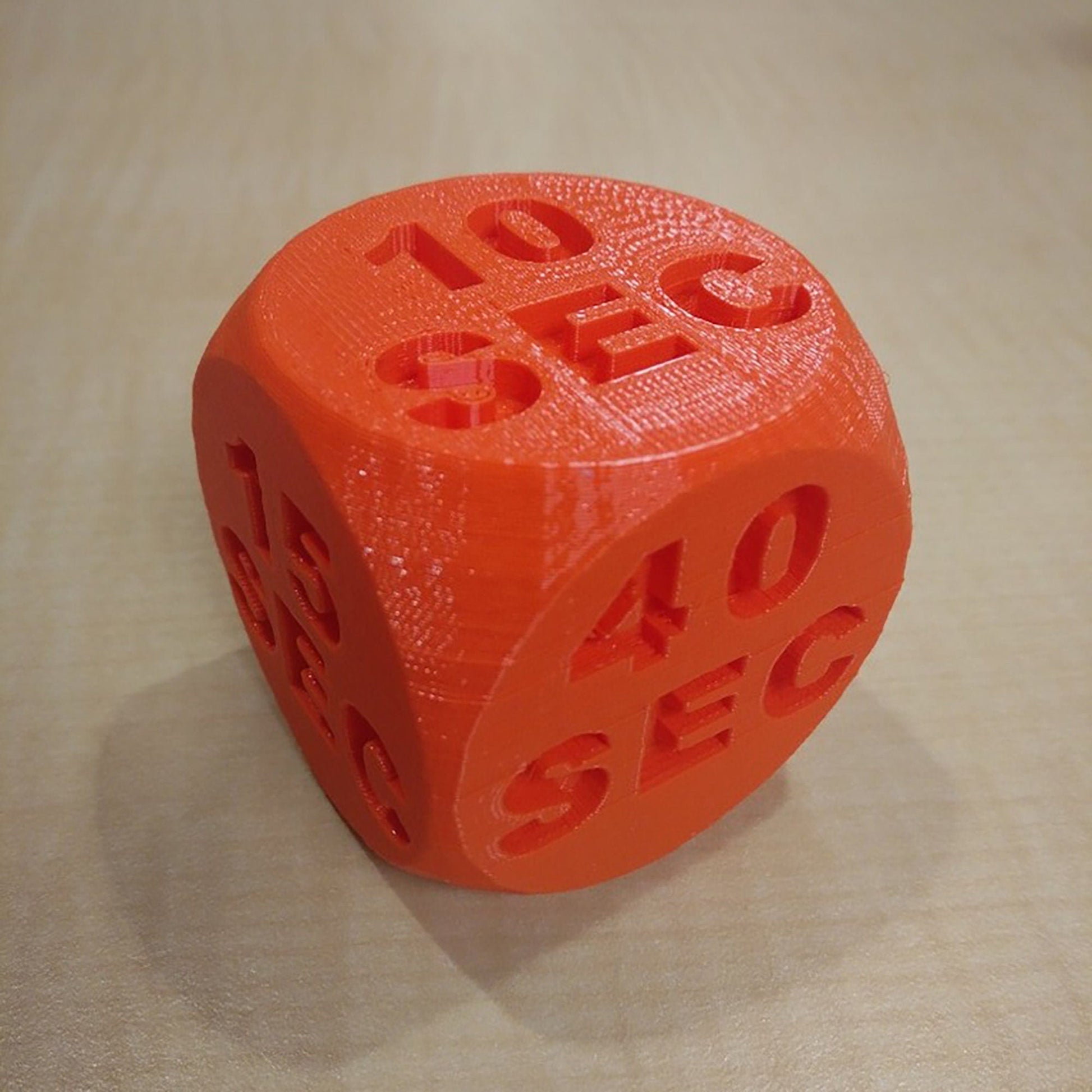 a close up of a dice on a table