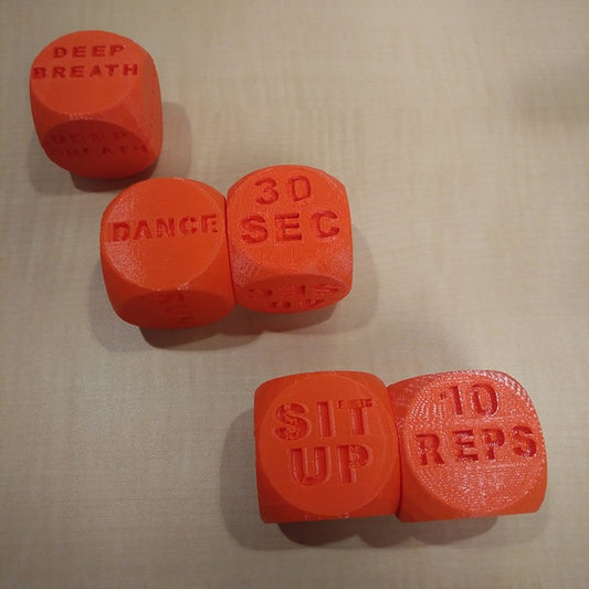 a couple of orange dices sitting on top of a table