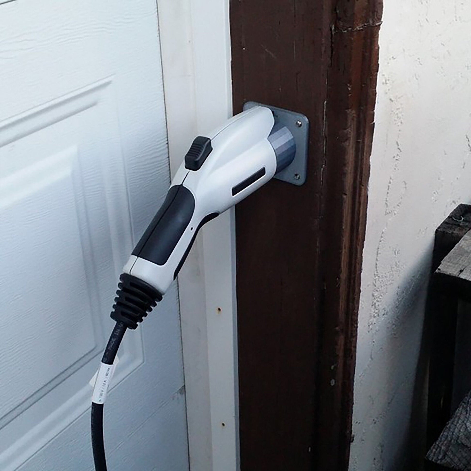 a hair dryer is plugged into a door