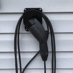 J1772 plug holder with flat backplate holding an EV charging connector nose-down, view 2