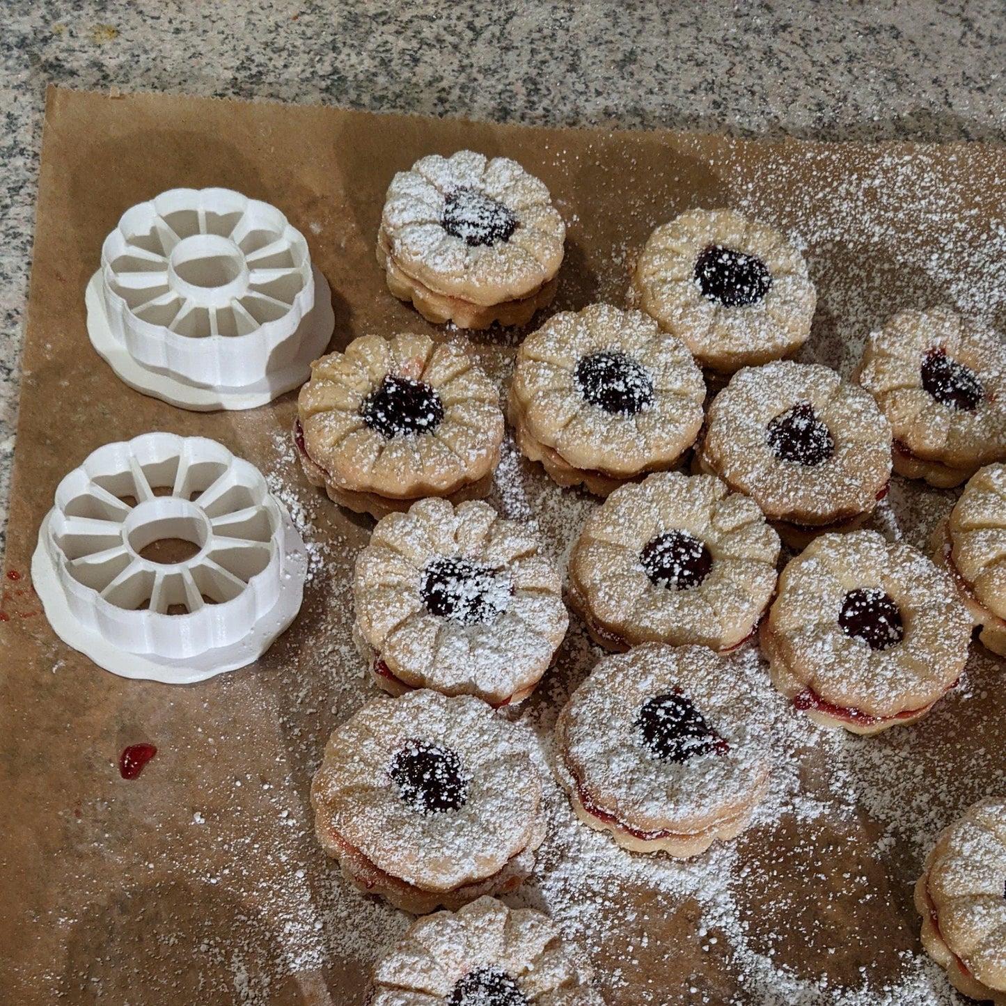 a table topped with pastries covered in powdered sugar