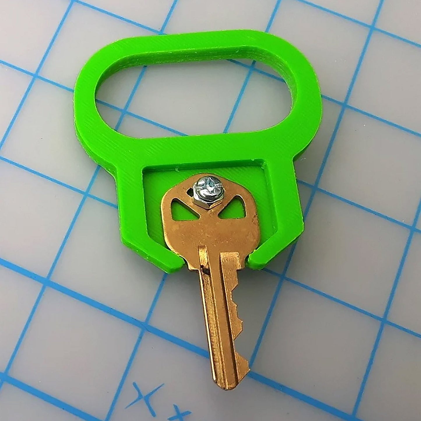 a green key with a diamond in the middle of it