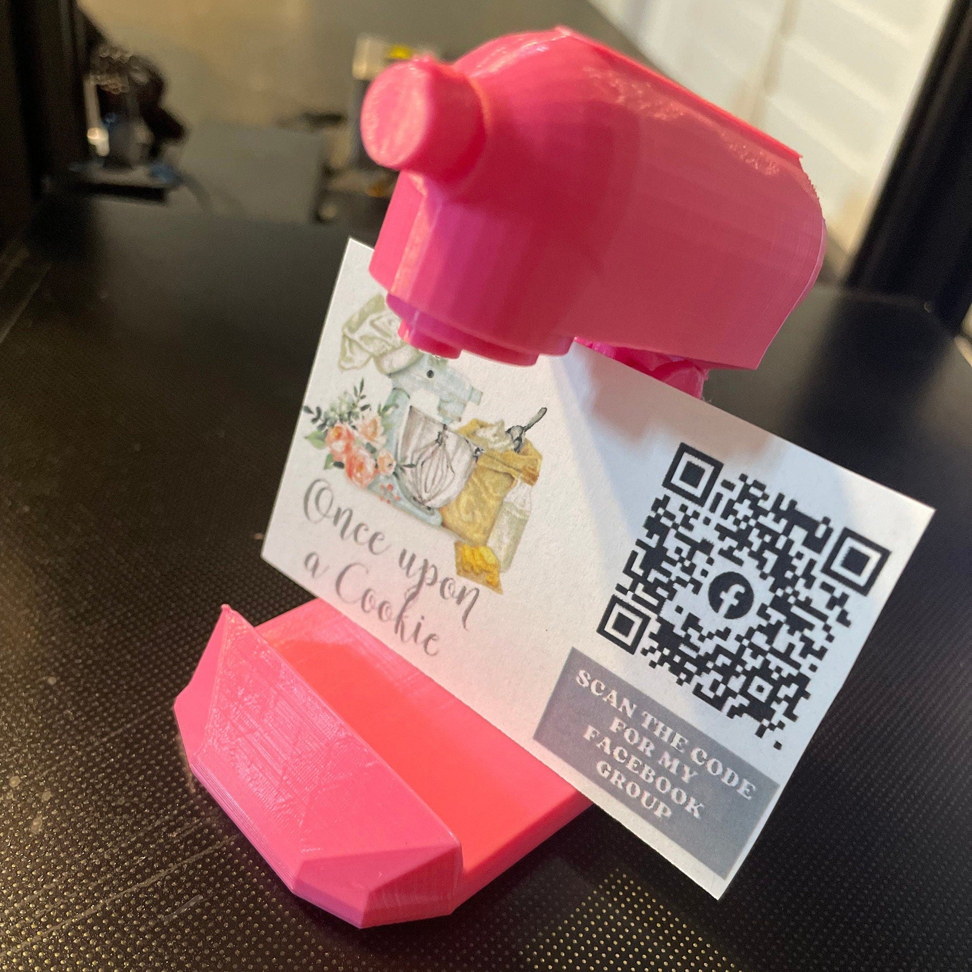 a pink piggy bank with a qr code attached to it