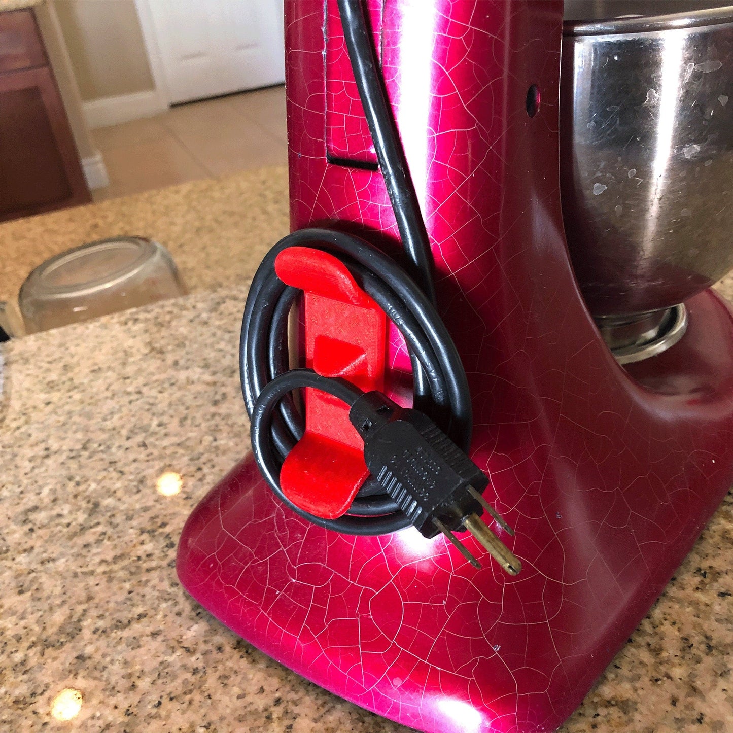 a red blender sitting on top of a counter