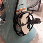 Adhesive twin-prong cord cleat on the back of a KitchenAid stand mixer, view 4