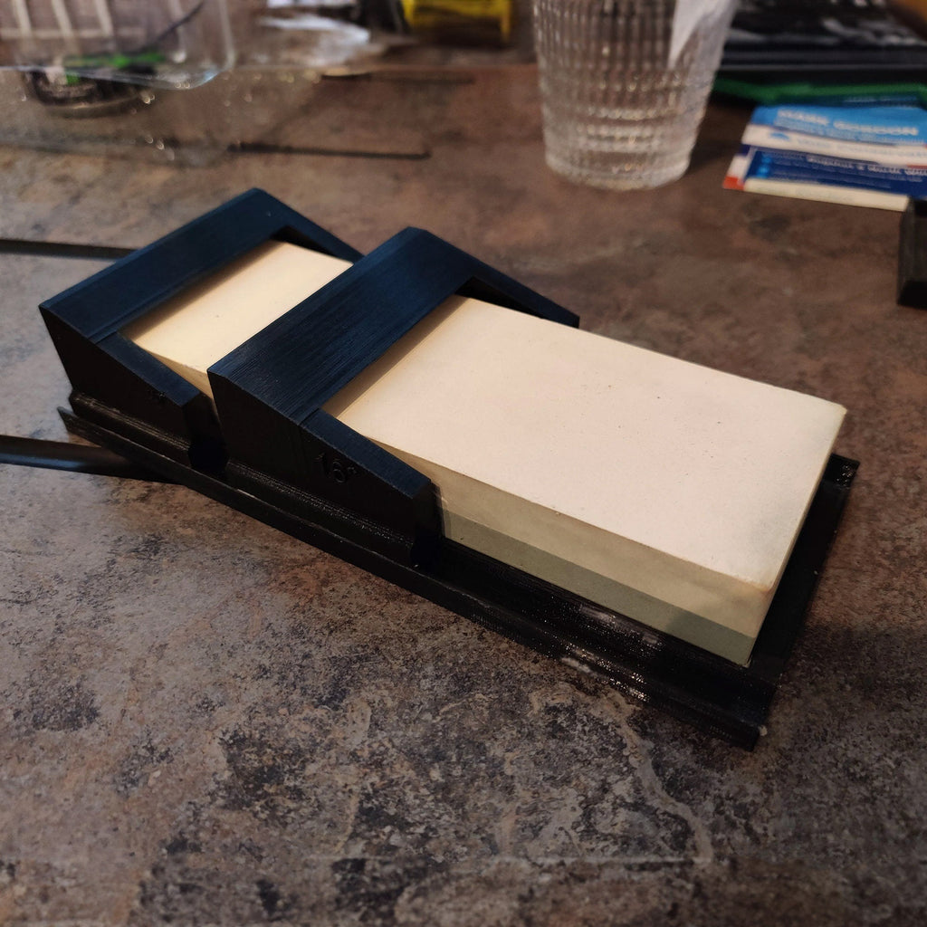 Knife sharpening angle guide holding a 60x180mm whetstone, view 3