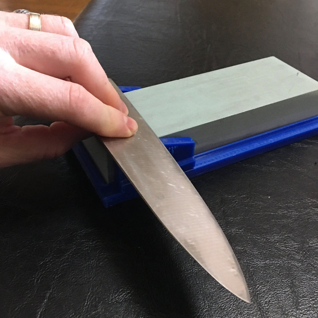 Knife sharpening angle guide holding a 60x180mm whetstone, view 4