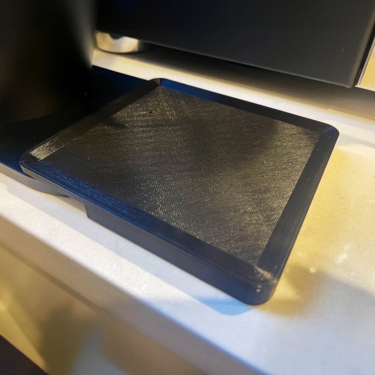 a black book sitting on top of a white counter