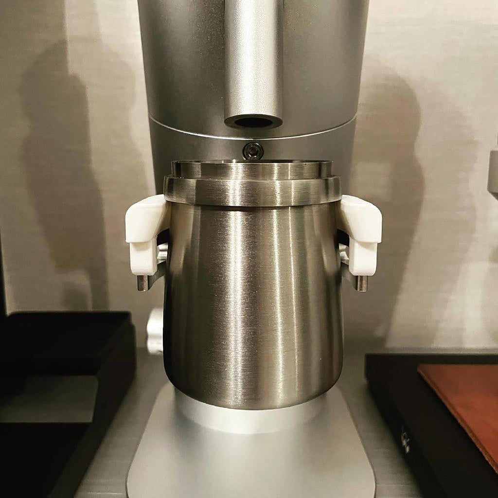 Dosing cup holder adapter mounted under the spout of a Lagom P64 grinder, view 4