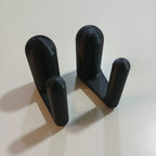 Clip-on laptop riser feet lifting the rear edge of a laptop for airflow, view 4
