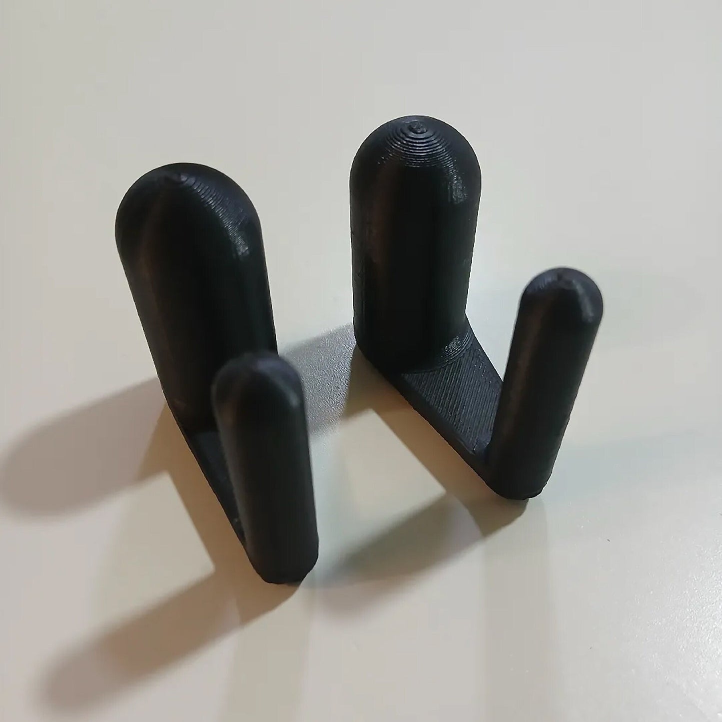 a couple of black handles sitting on top of a table