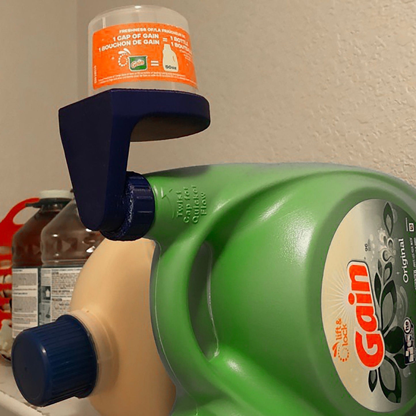 a close up of a bottle of liquid on a shelf