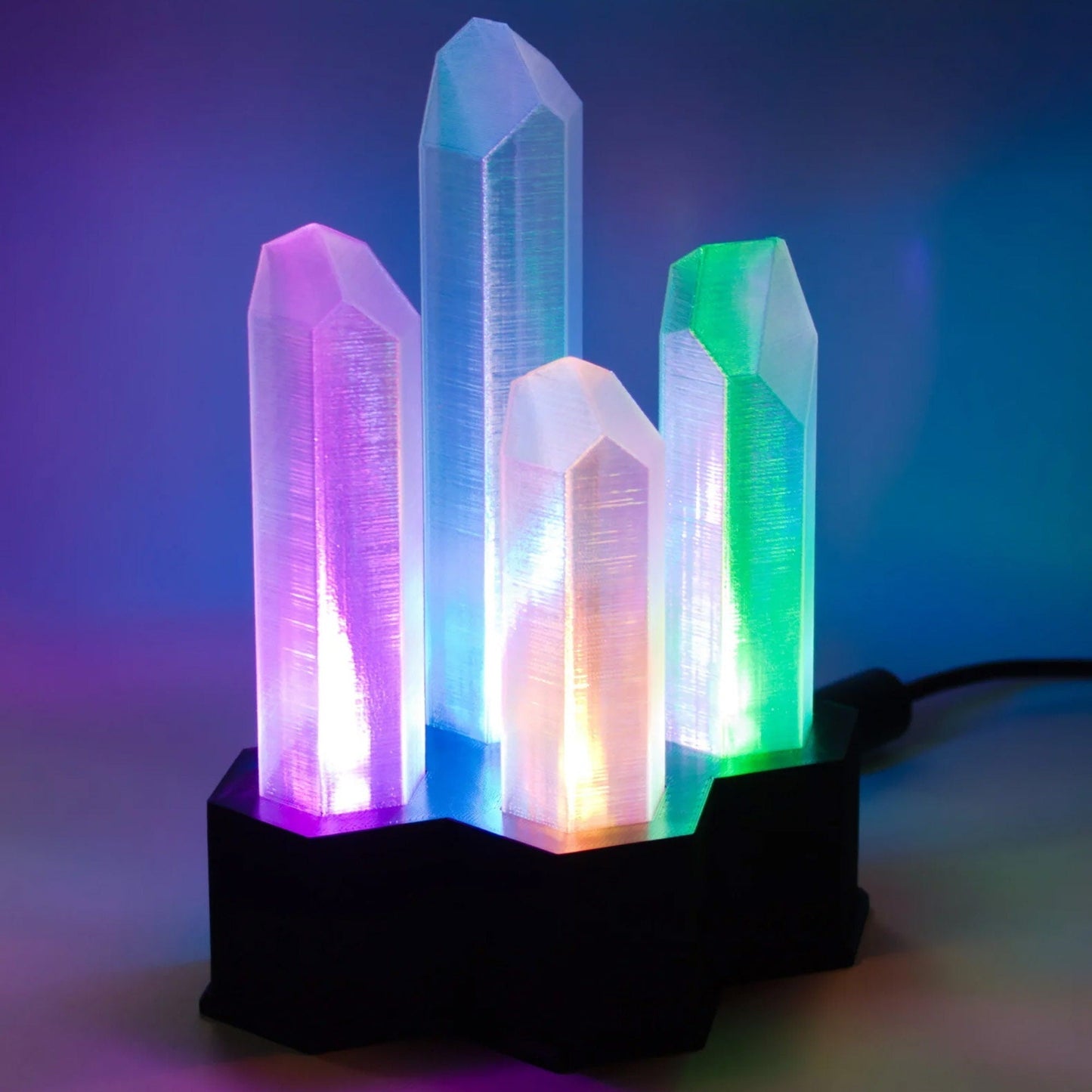 a group of three crystal blocks sitting on top of a table