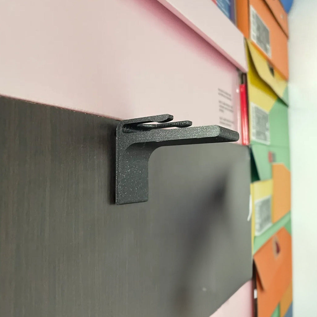 Wall mounted hat rack hooks displaying baseball caps in a row, view 2