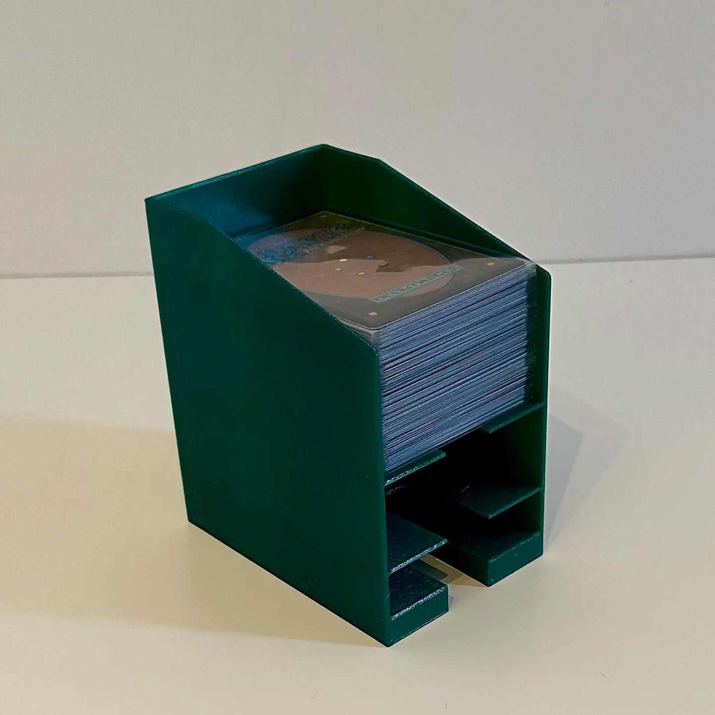 a stack of cards in a green holder