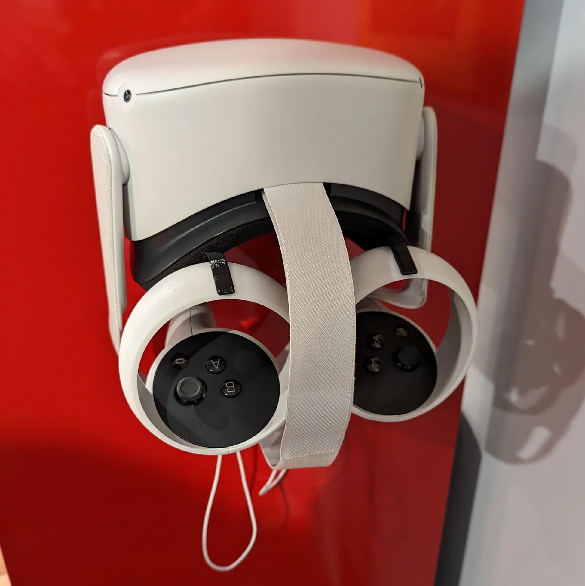 a security camera attached to a red wall