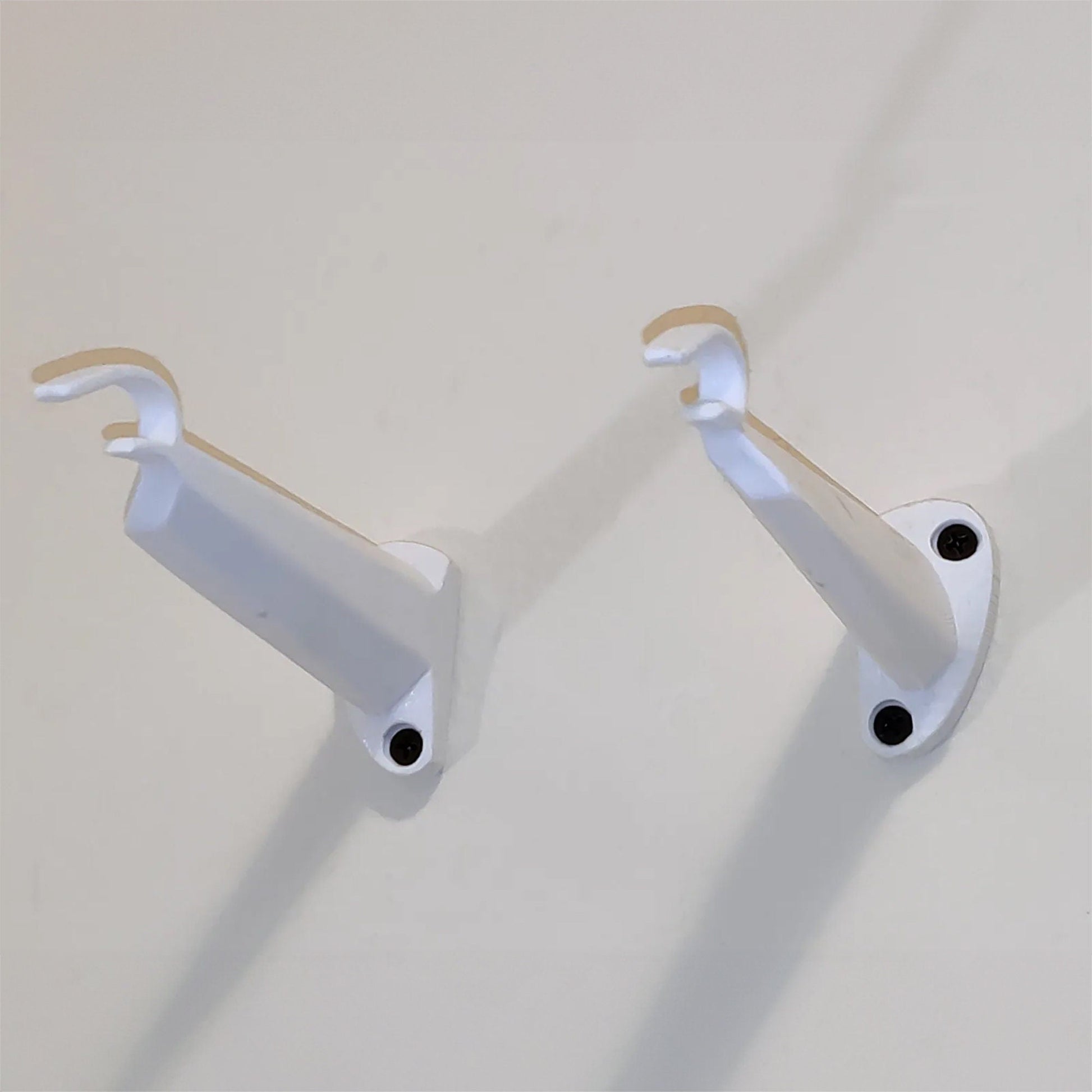 a couple of white handles on a wall