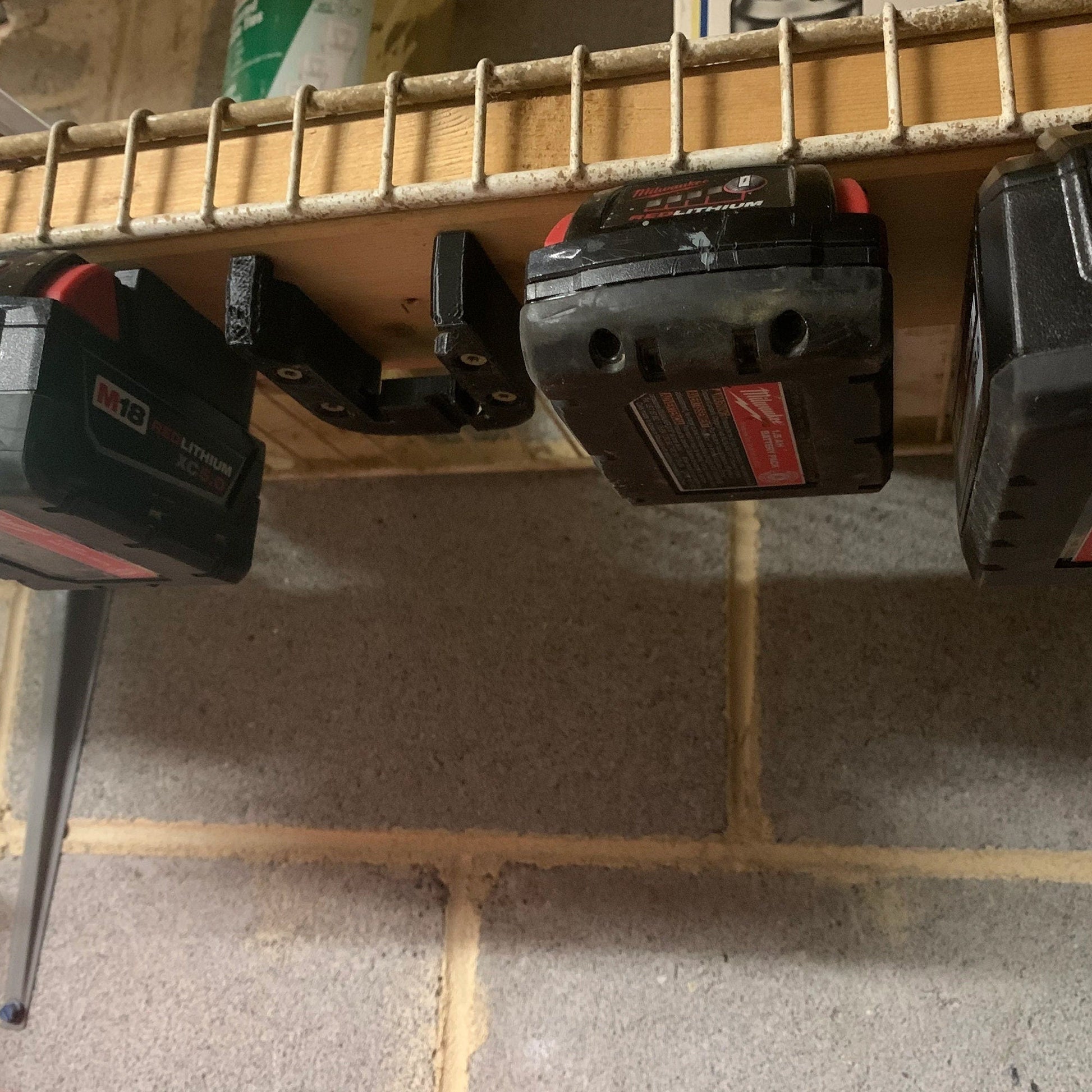 a couple of power tools are on a shelf