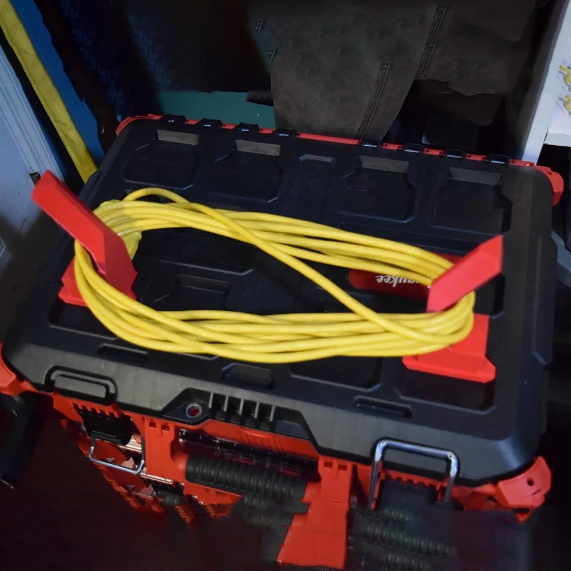 a tool box with a yellow cable in it