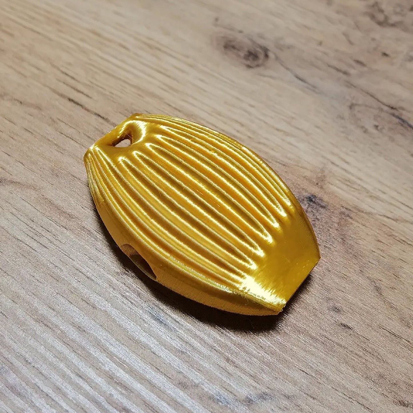 a yellow object sitting on top of a wooden table