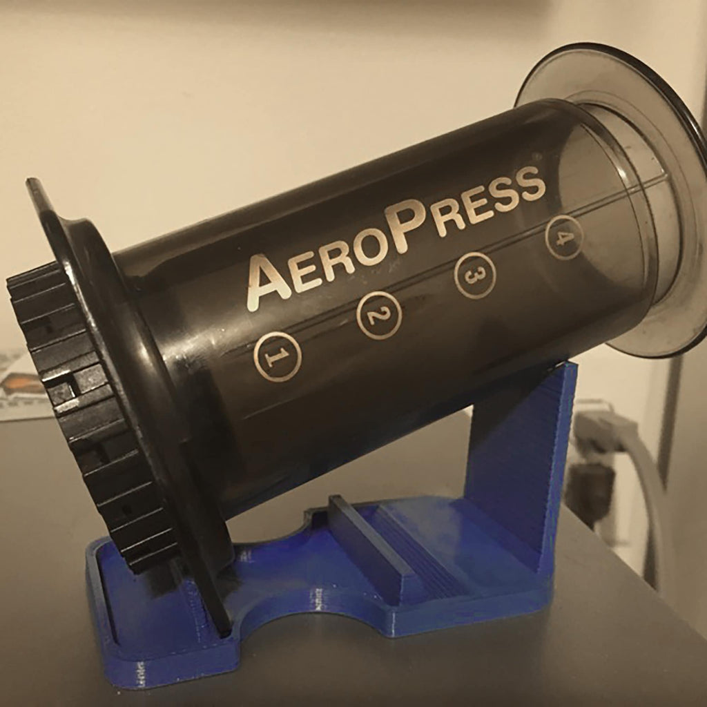 Drip drying stand holding an AeroPress coffee maker upside down, view 3