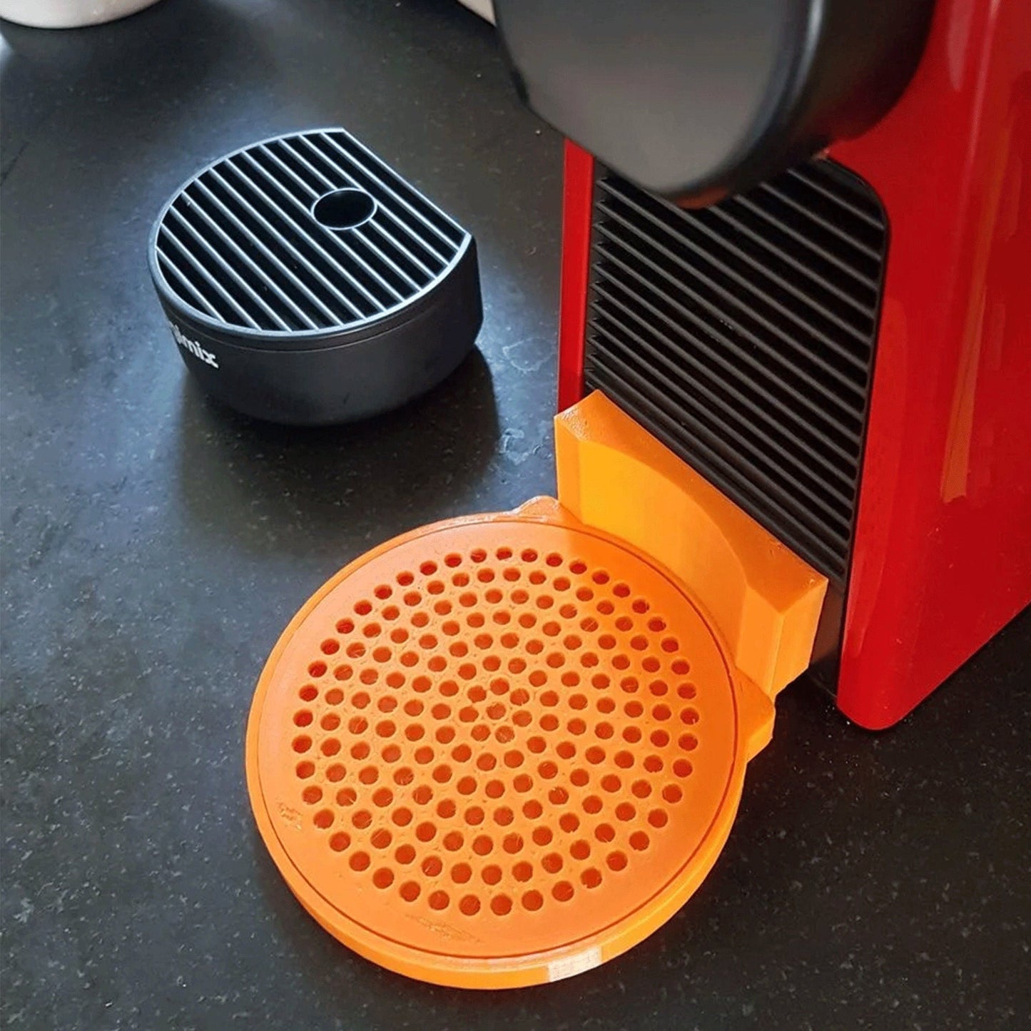 a close up of a coffee maker on a table