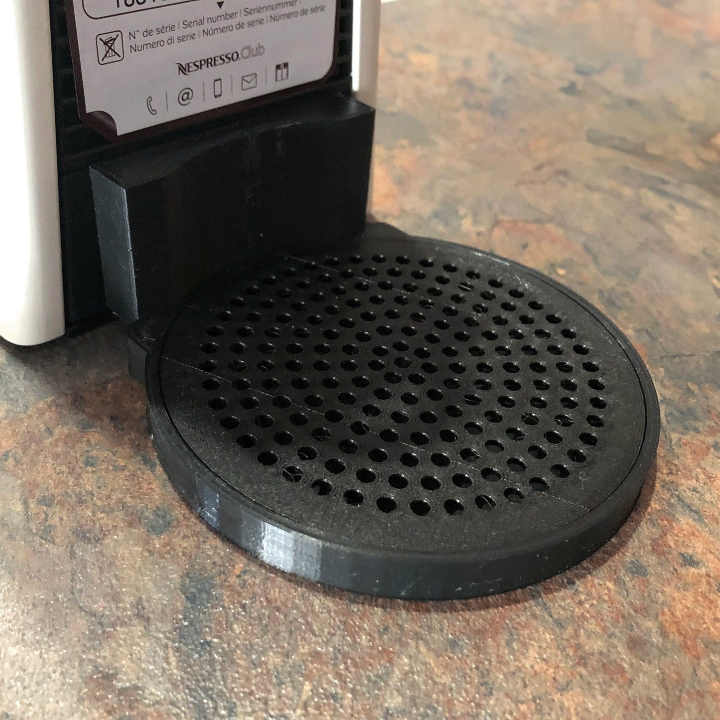 a close up of a black and white device on a table