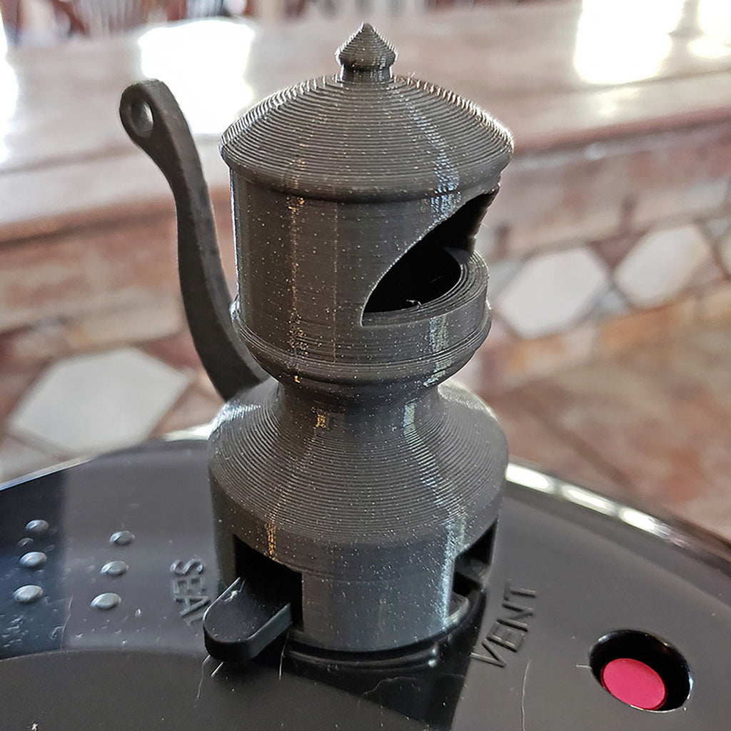 Train whistle shaped steam diverter on a Ninja Foodi pressure cooker lid