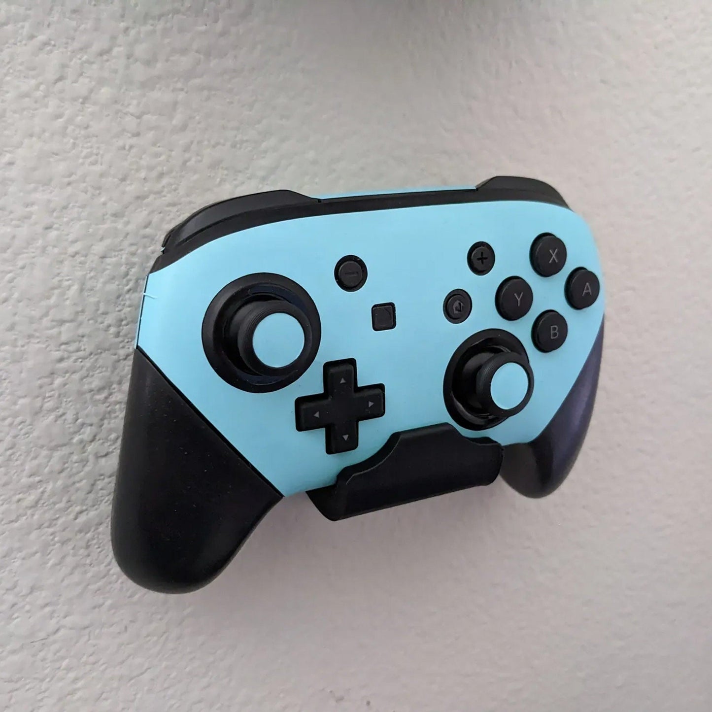 a close up of a controller on a wall