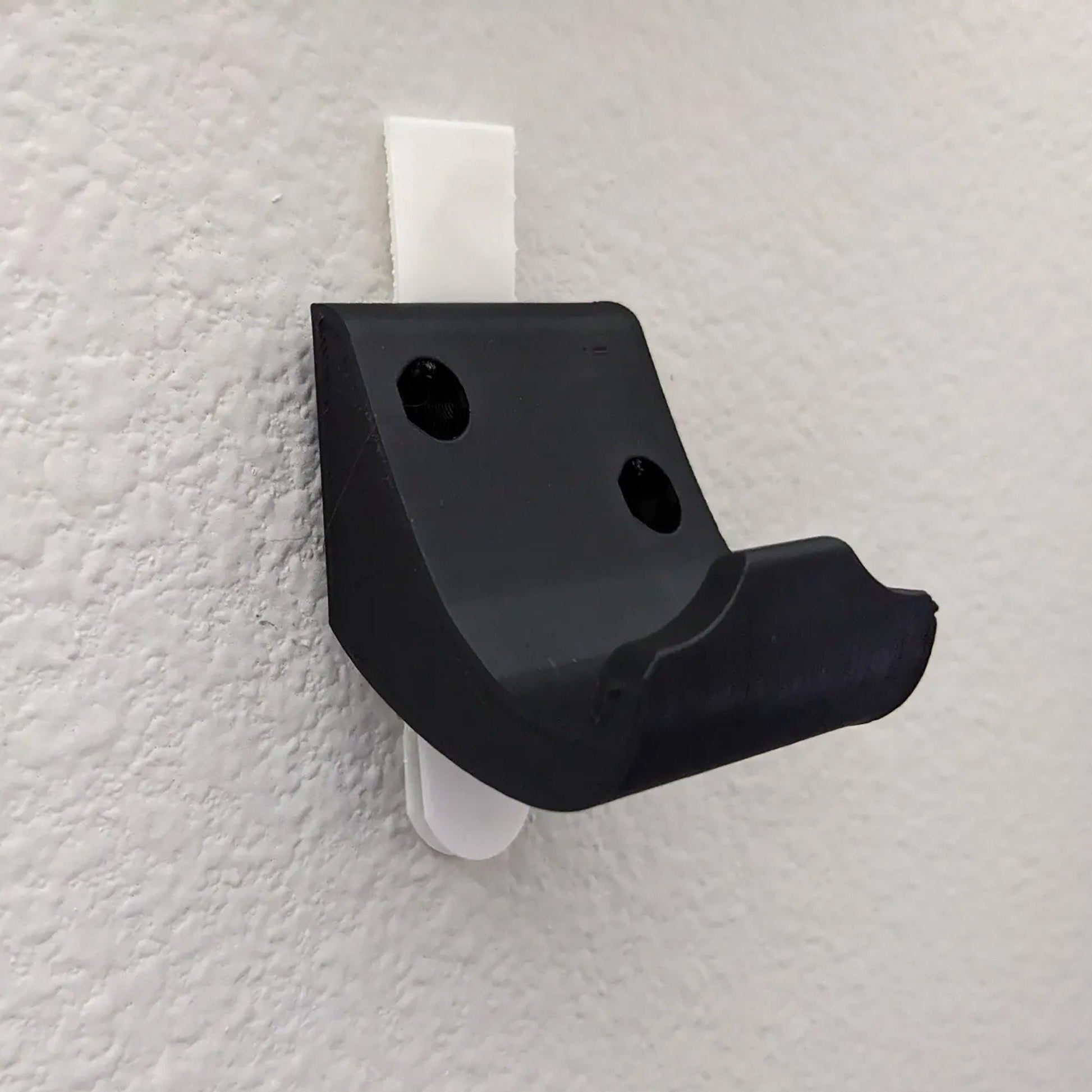 a close up of a black and white object on a wall