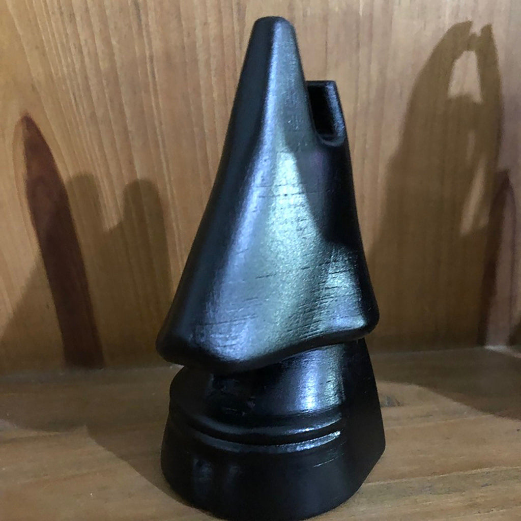 Nose shaped eyeglasses holder stand cradling a pair of glasses, view 3
