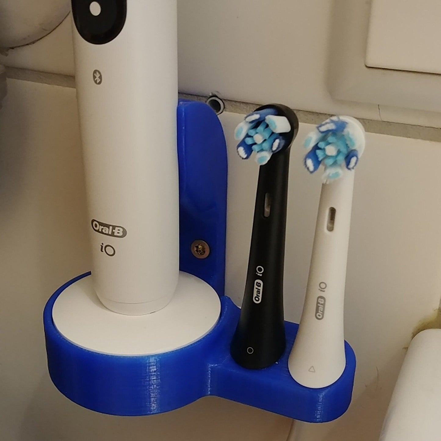 a couple of toothbrushes sitting on top of a holder