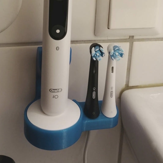 a couple of toothbrushes that are on a holder