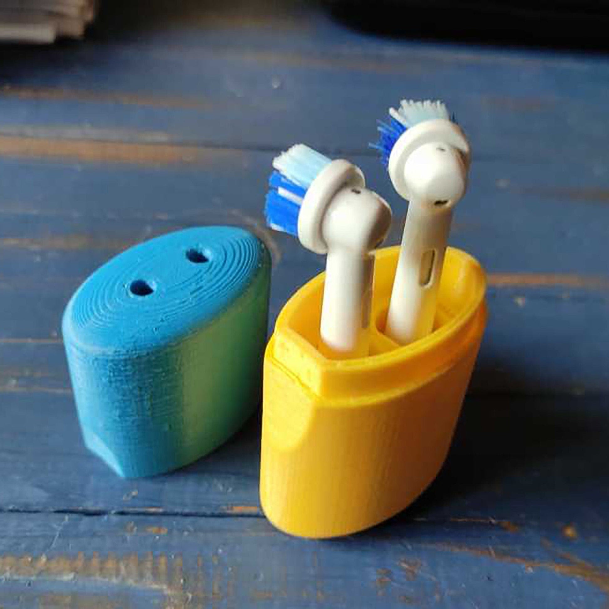 a couple of toothbrushes in a cup on a table