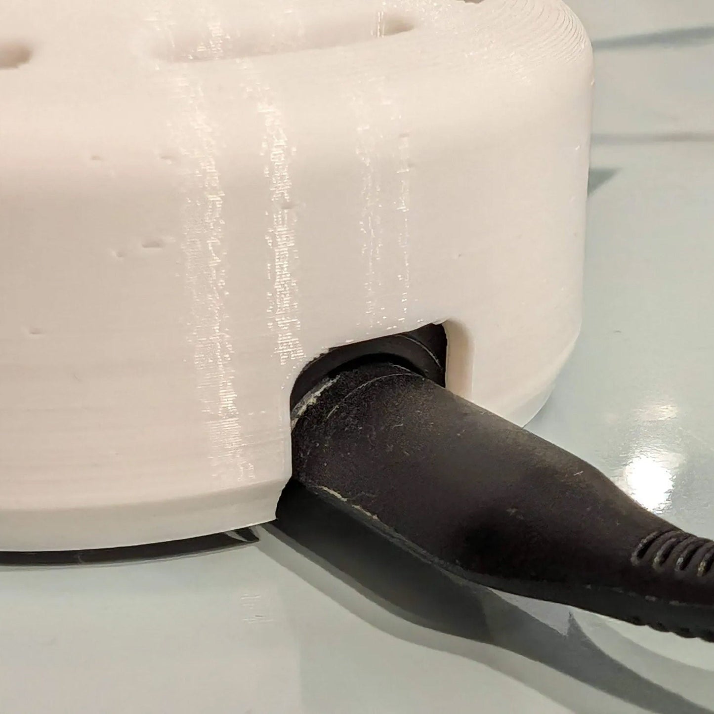 a close up of a knife cutting a cake