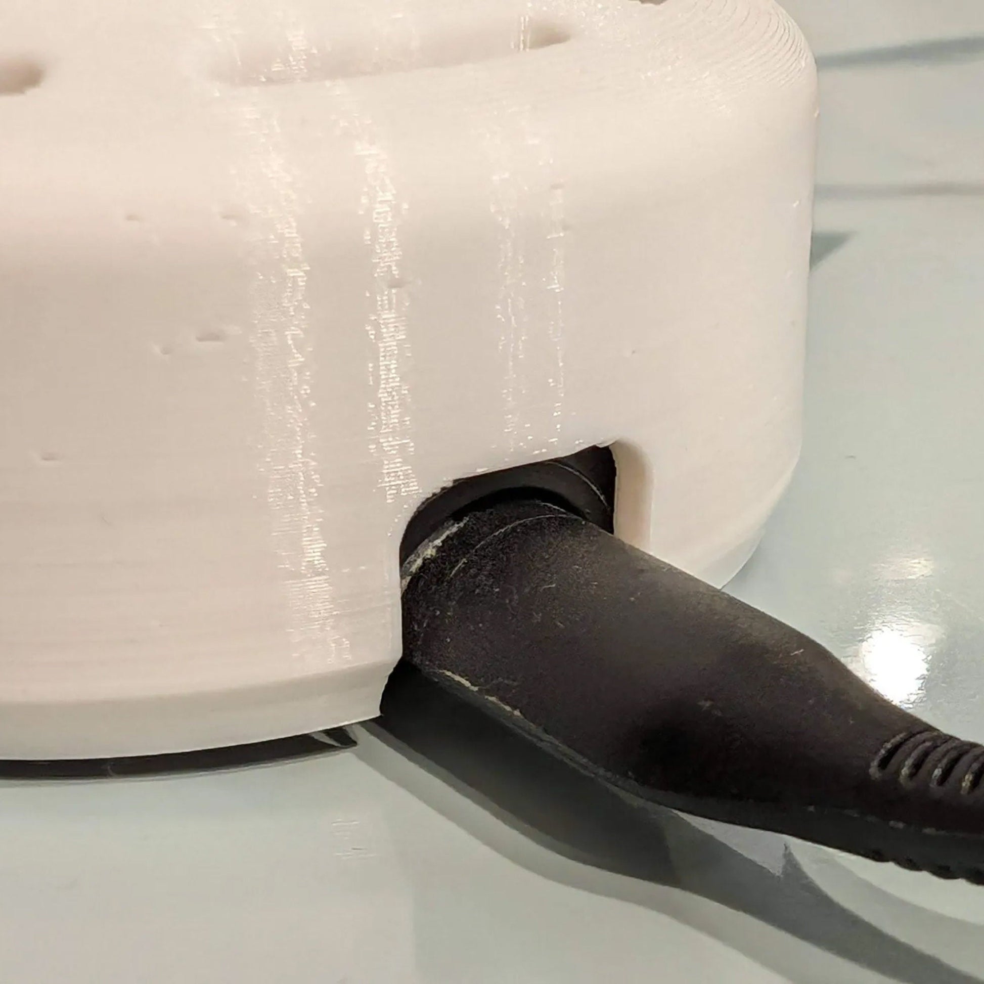 a close up of a knife cutting a cake