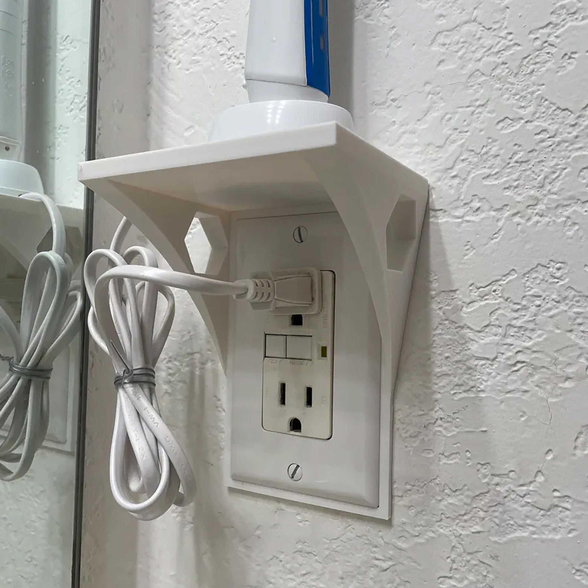 a white electrical outlet attached to a wall