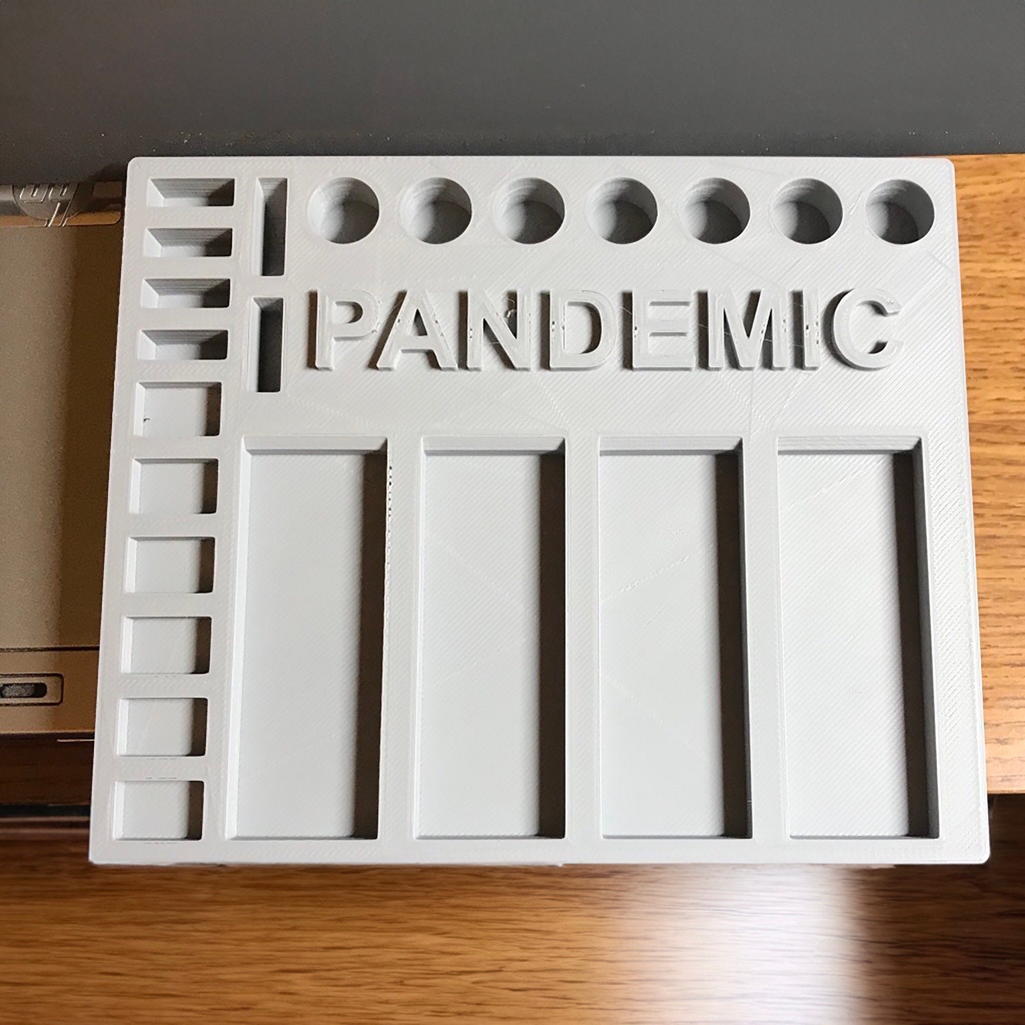 a plastic pan with the word pandemic on it