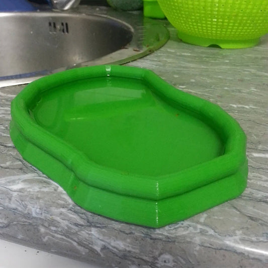 a green tray sitting on top of a kitchen counter