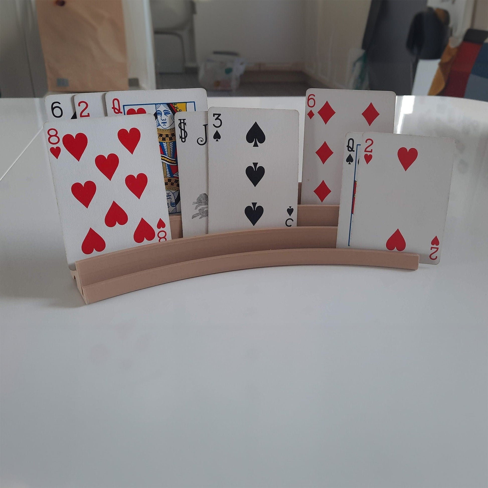 a stack of playing cards sitting on top of a table